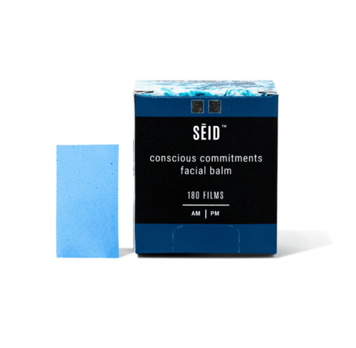 The SĒID™ Conscious Commitments Facial Balm Product Box and Film Strip Standing Against a White Background